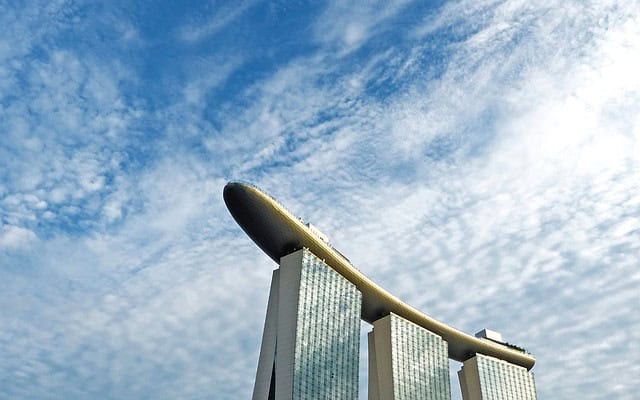 Modern data analytics building with futuristic design and clear sky background.