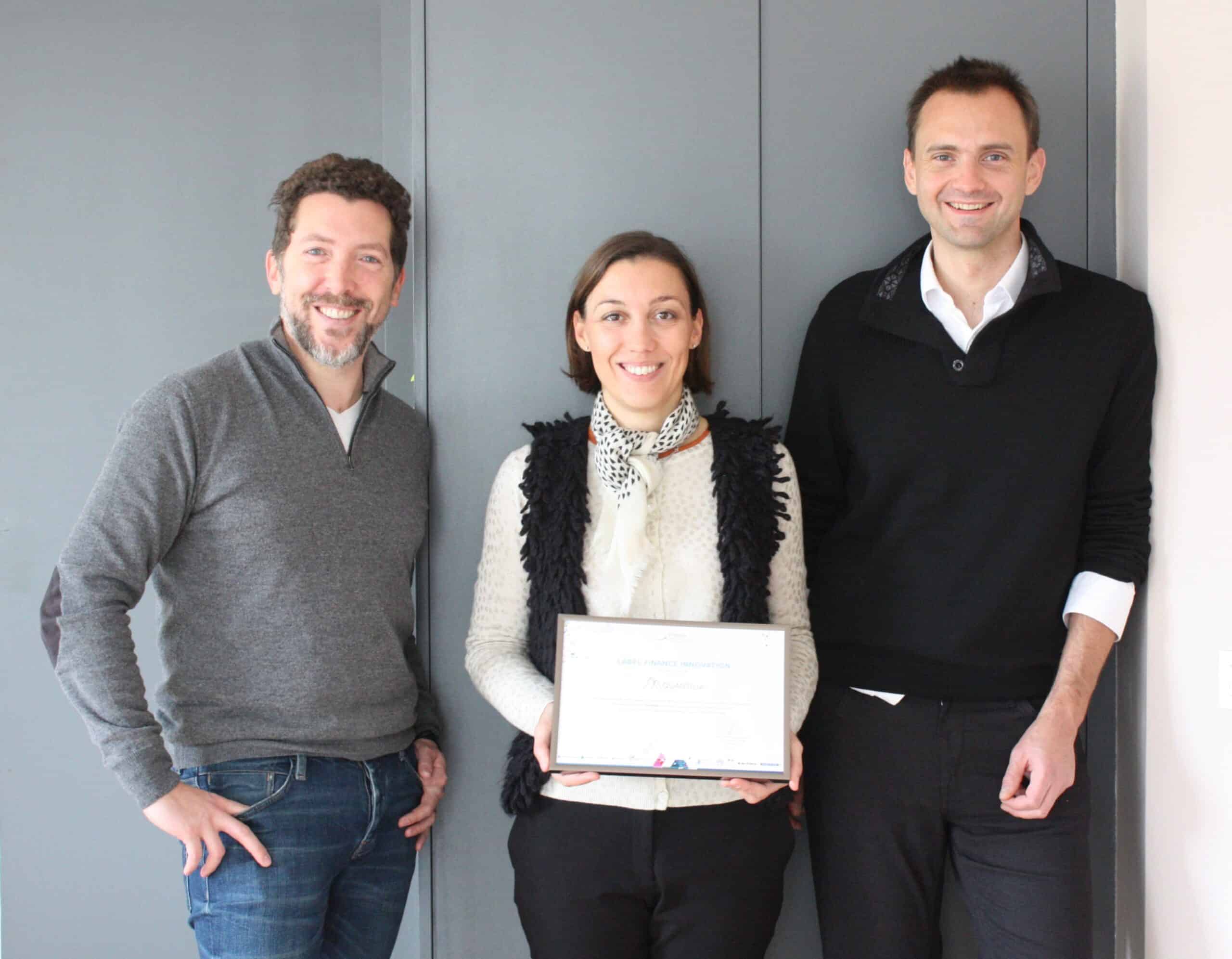 Data analytics team celebrating achievement at Quantilia.