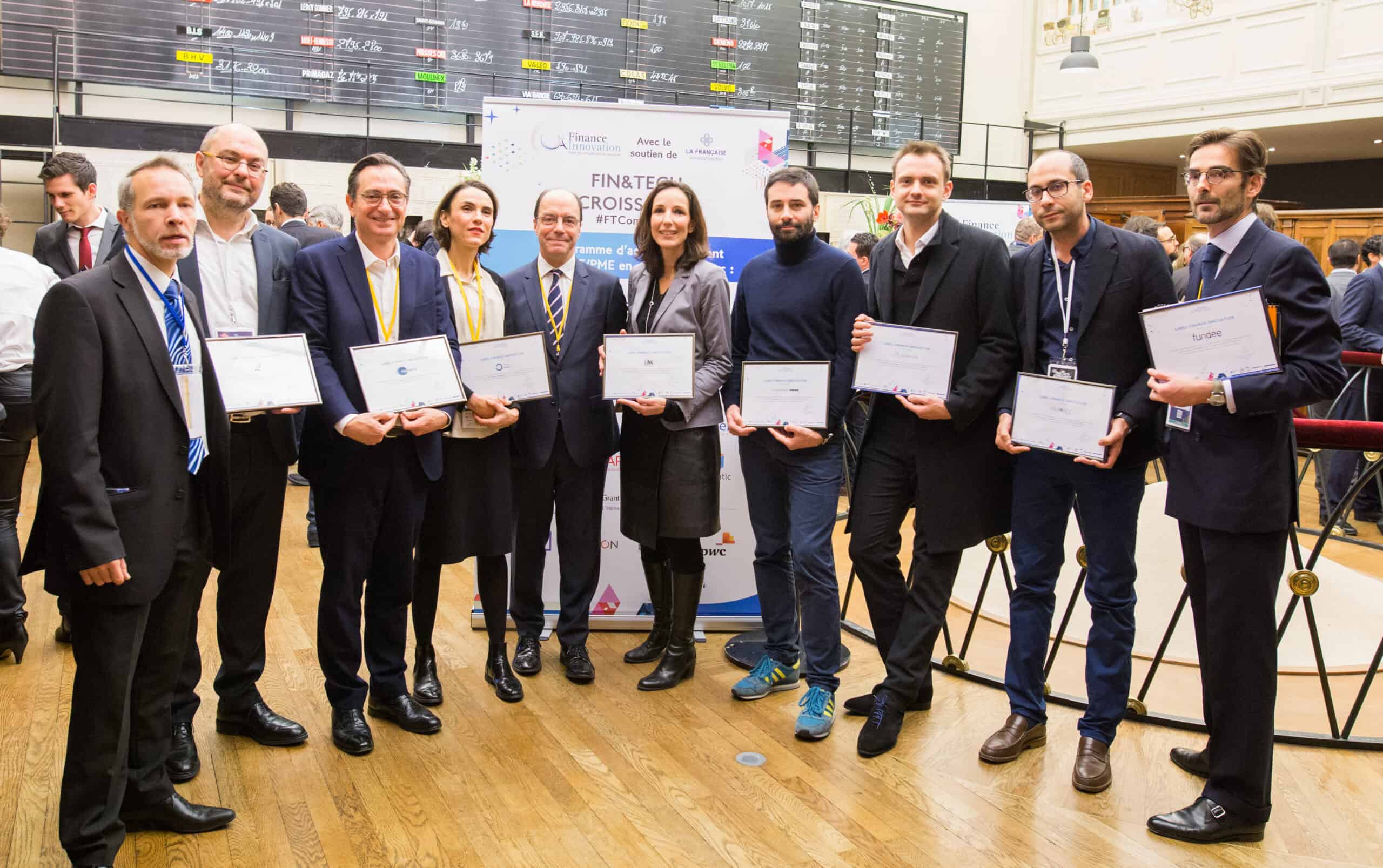Group of professionals receiving awards at a financial conference.
