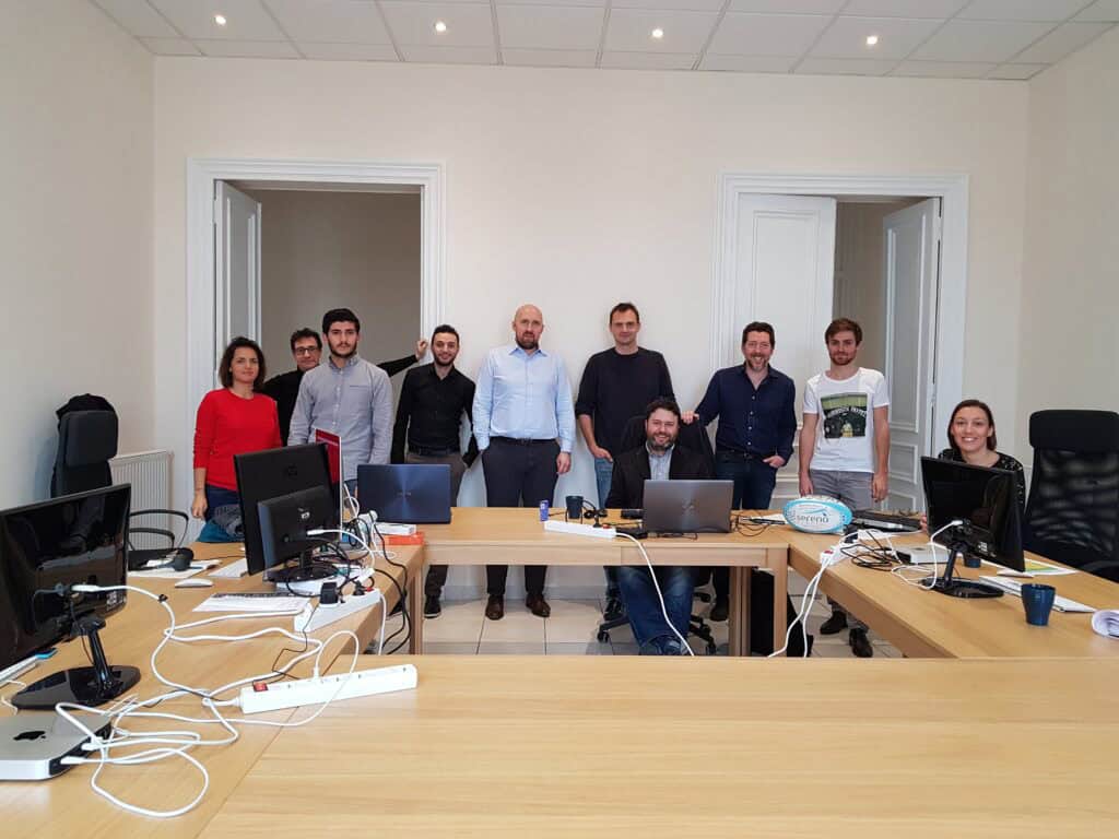 Team meeting in a modern office conference room at Quantilia.