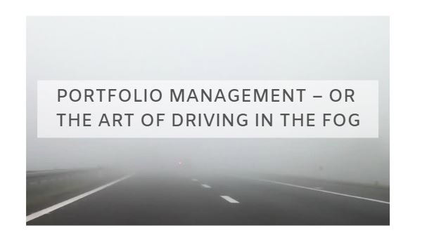Portfolio management concept with foggy road background.