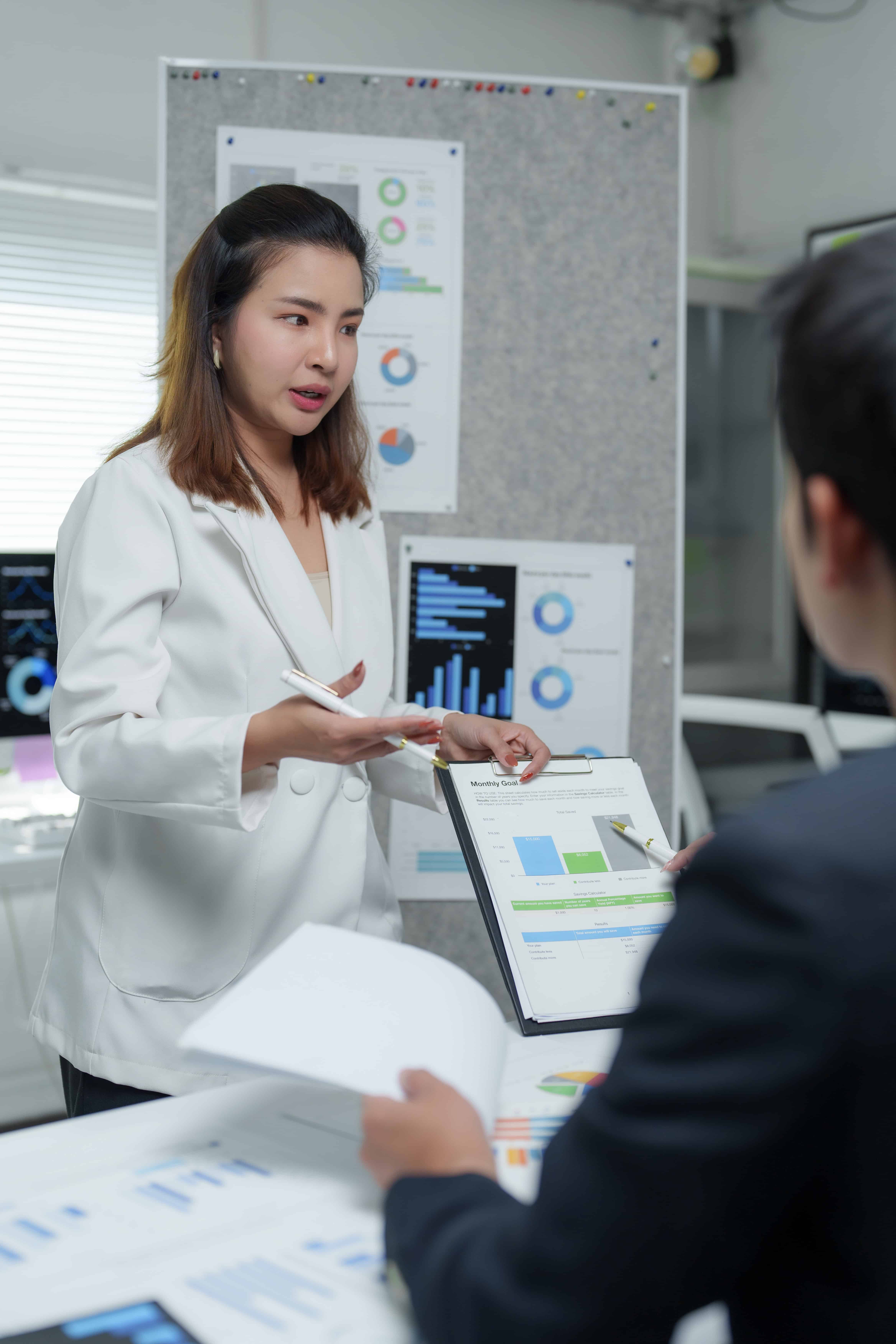 businesswoman showing business chart to her collea 2025 06 22 19 54 23 utc