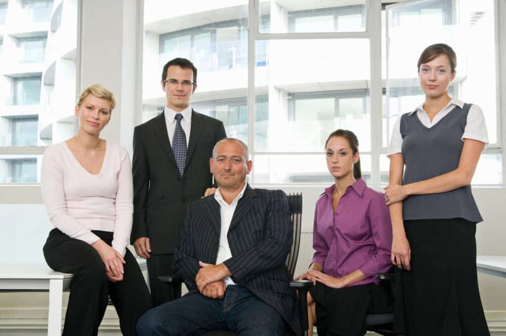 Professional asset management team in modern office setting.