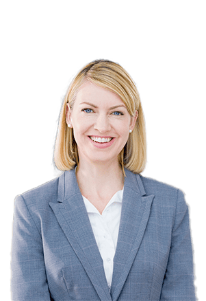 Businesswoman in a suit smiling, representing asset management services.